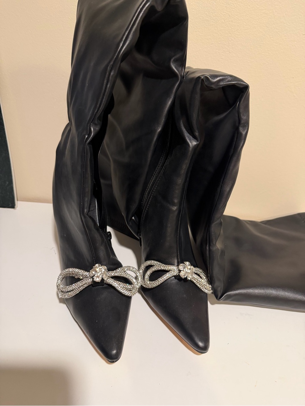 Black Knee-High Pointed Toe Boots with Crystal Bow Accent
